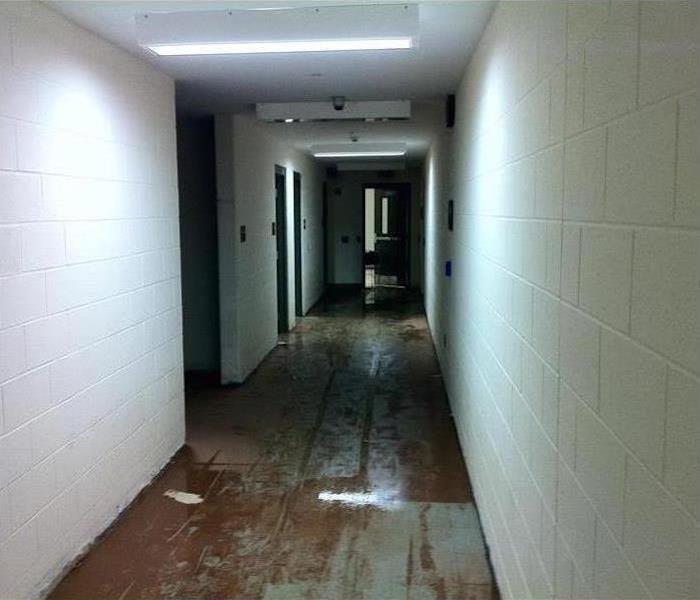 sewage on tiled floor in a corridor