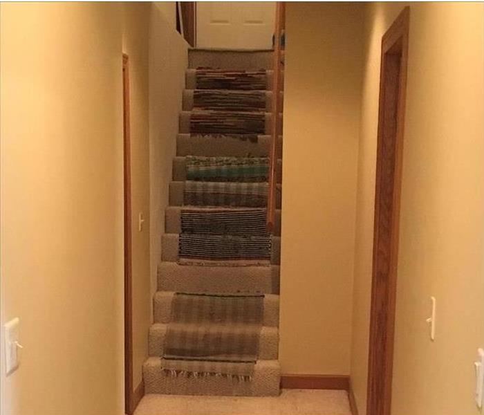 wet, dirty carpet on stairs