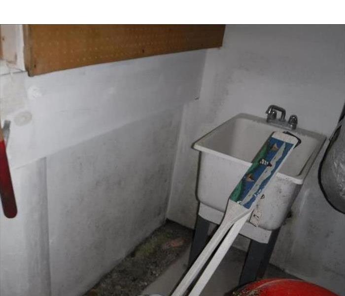 mold visible on walls and sinks