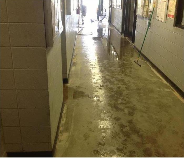hall in school, wet, muddy floors
